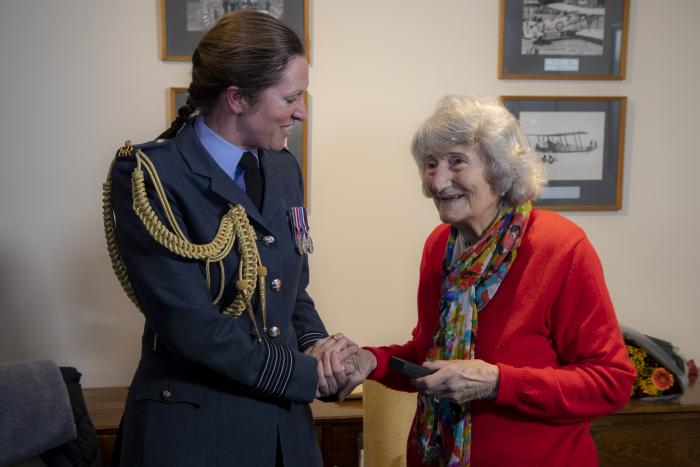 LAC Anne-Marie Allen receives her World War Two medal from Gp Capt Toria McPhaden