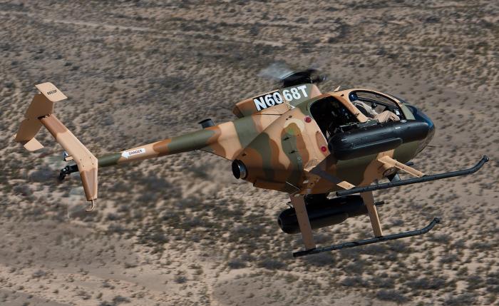 An MD 530F Cayuse Warrior (registration N6068T) in-flight. The Nigerian Army has ordered 12 Cayuse Warrior Plus helicopters from MDHI to support its counterinsurgency and counter-terrorism mission sets.