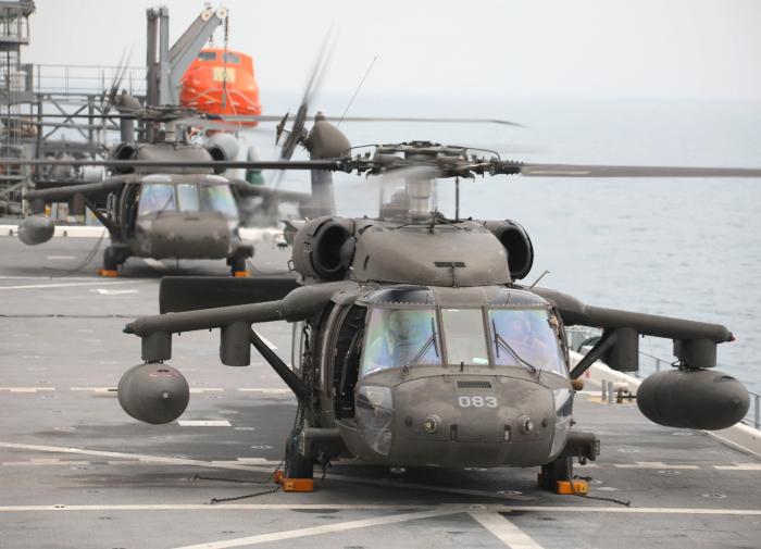 A pair of US Army UH-60M Black Hawks assigned to the New York ARNG’s 3-142nd AVN – but operating under the command of the 36th CAB – conducts deck landing training aboard the US Navy’s first purpose-built expeditionary mobile base vessel, USS Lewis B Puller (ESB-3), in the Persian Gulf on November 10, 2022.